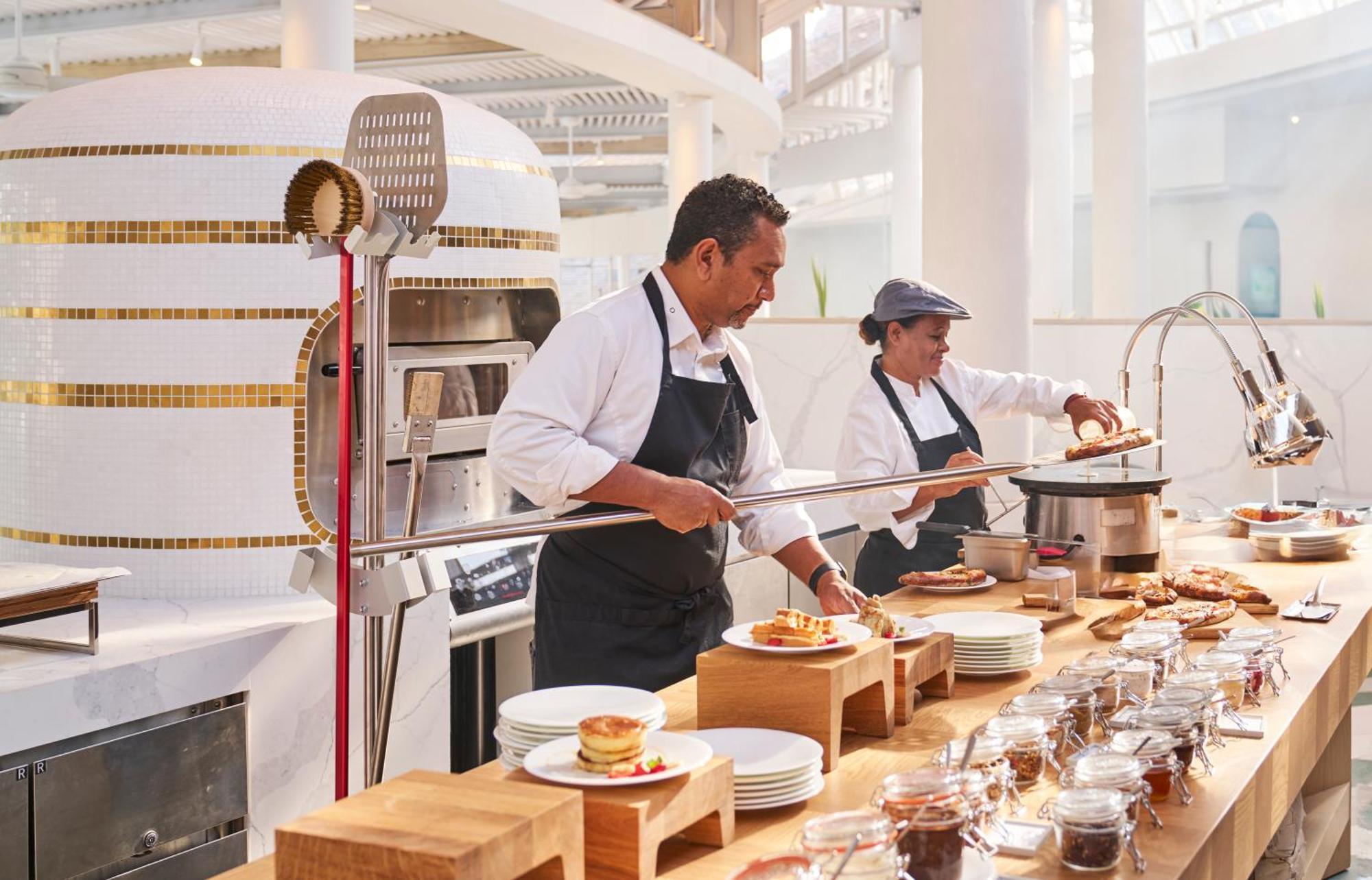 LUX* Belle Mare Resort&Villas Esterno foto A chef working in a restaurant kitchen